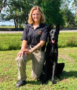 Here's Brooke Fillingim with a solid black German Shepherd Dog that she has trained