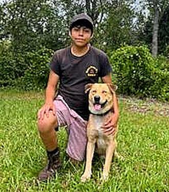 Animal Care Specialist, Gus Soriano, with his personal dog.